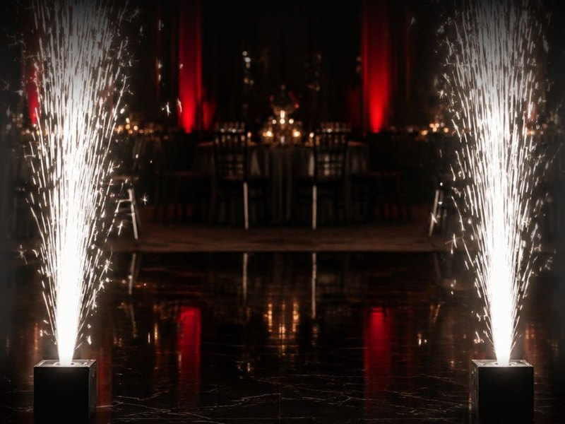 Two cold spark machines firing on a dance floor